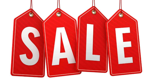 Hang tag label printing showcasing red sale tags with bold letters for marketing purposes.