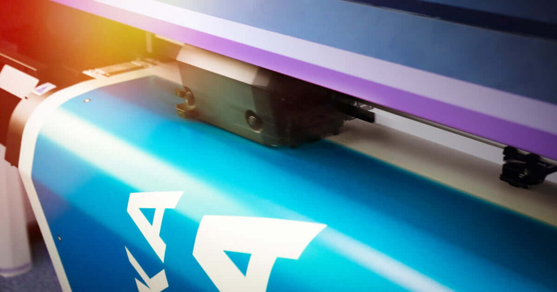 Close-up of a high-quality printing machine producing vibrant booklet prints.
