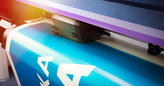 Close-up of a high-quality printing machine producing vibrant booklet prints.
