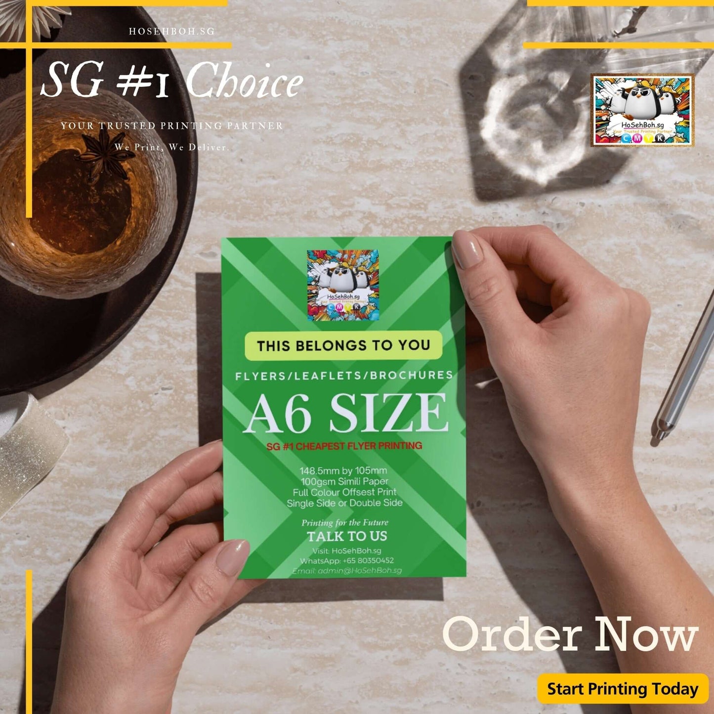 A6 size flyer being held, promoting affordable flyer printing services in Singapore. Order now for vibrant prints!