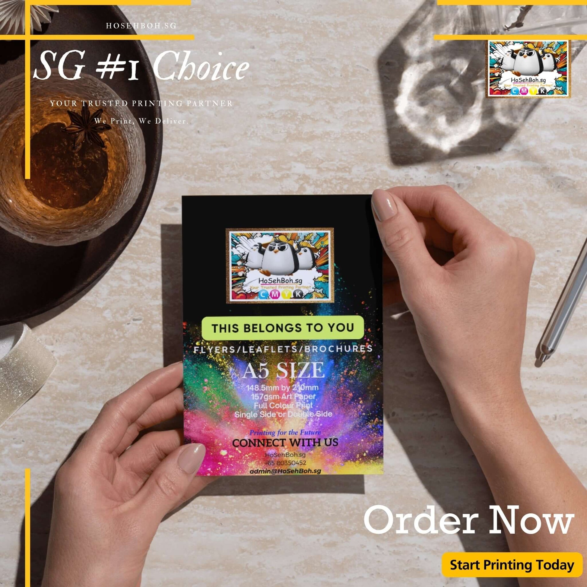 Person holding a vibrant A5 flyer promoting cheap printing services in Singapore.