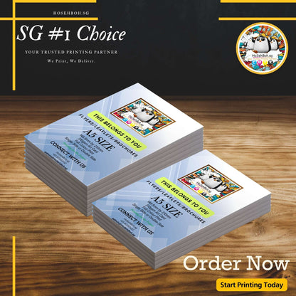 A5 flyers stacked on a wooden table promoting cheap flyer printing in Singapore with vibrant graphics.