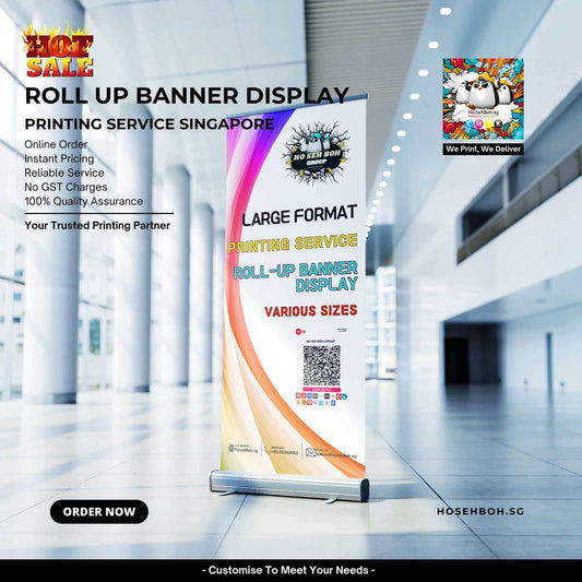 Roll up banner display for printing services in Singapore, showcasing large format options and quality assurance.